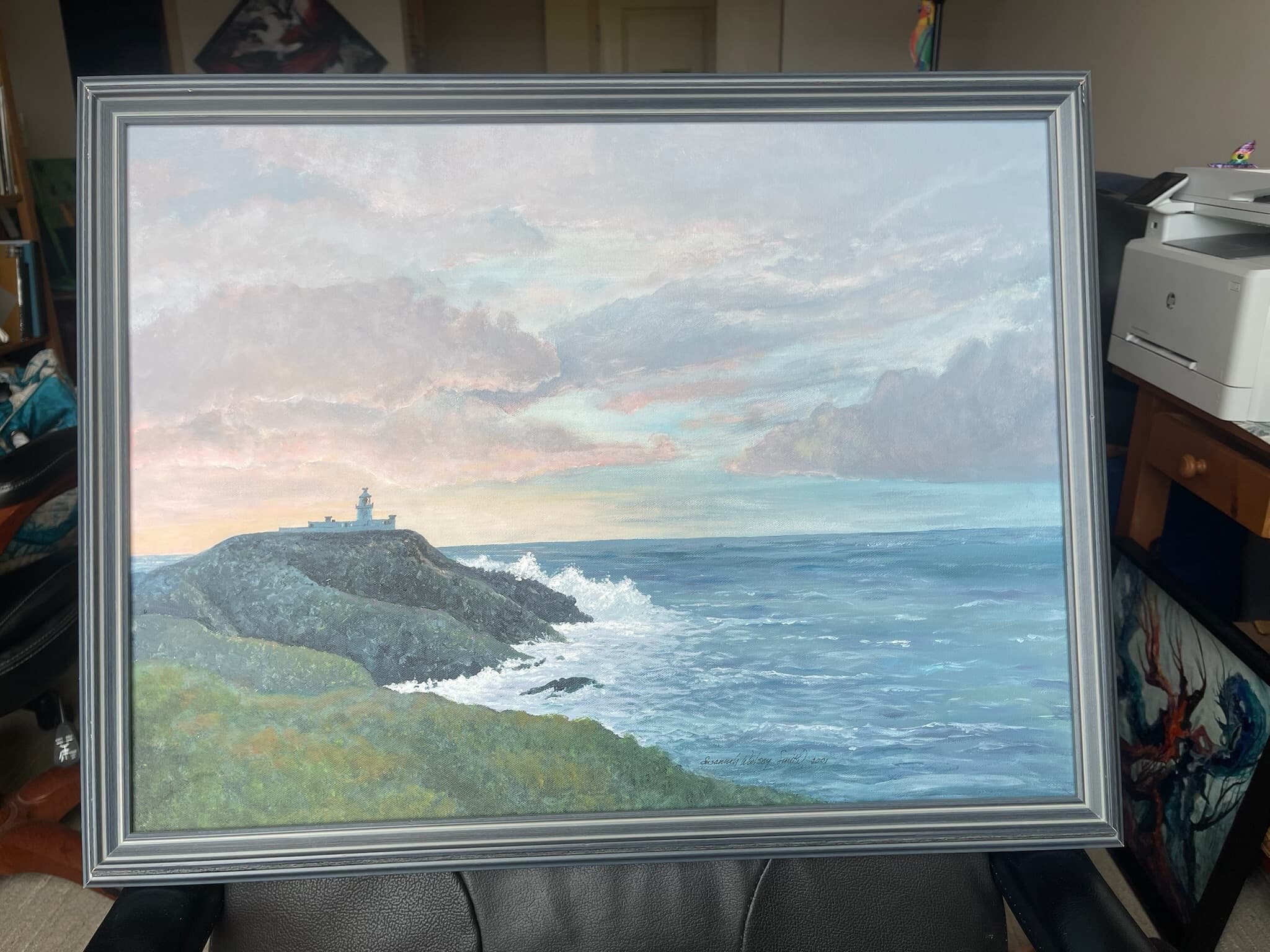 Lighthouse on Rocky Coast at Sunset